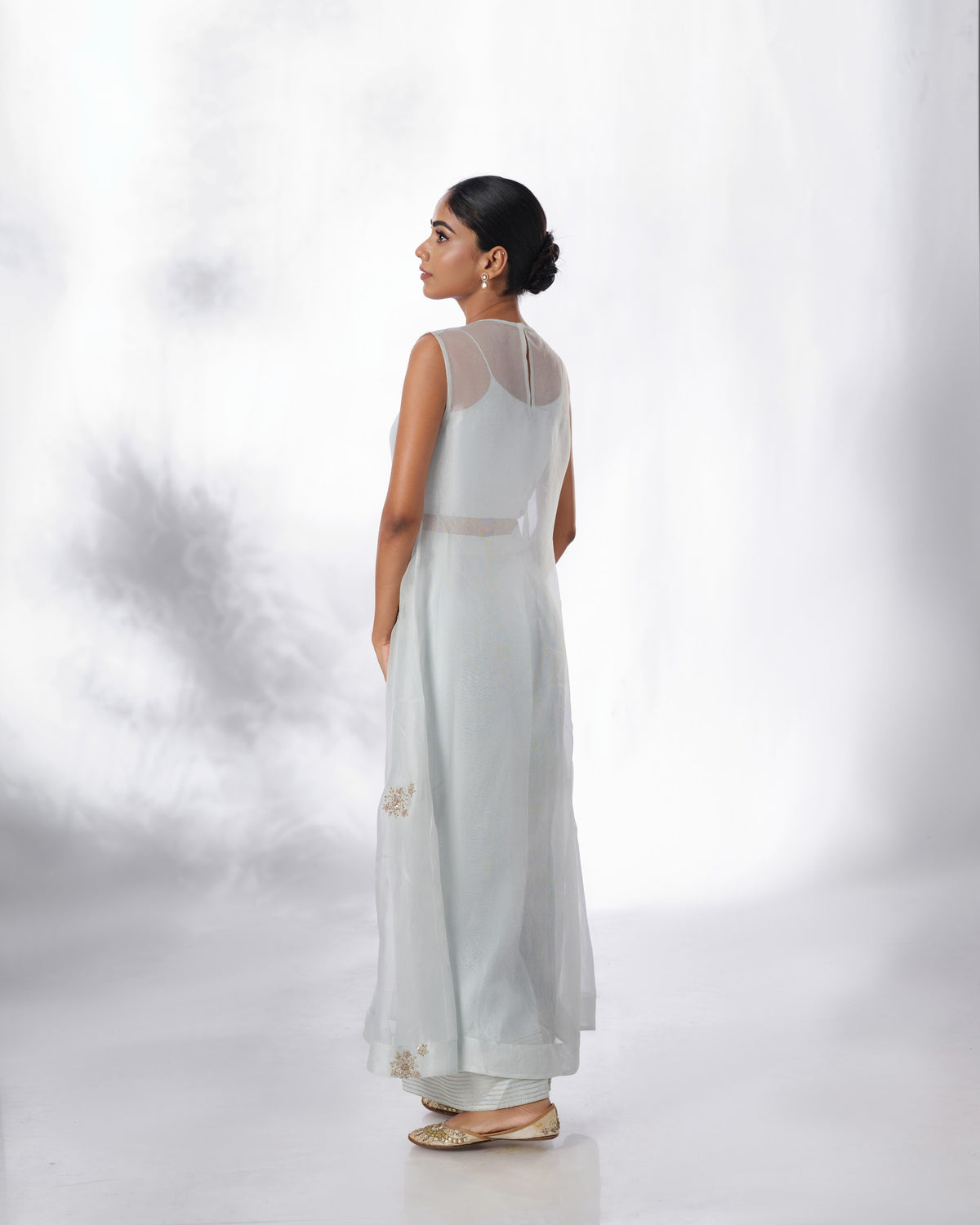 Model wearing the Spa Blue Silk Organza Butta Set by Kpret by Kalakaari