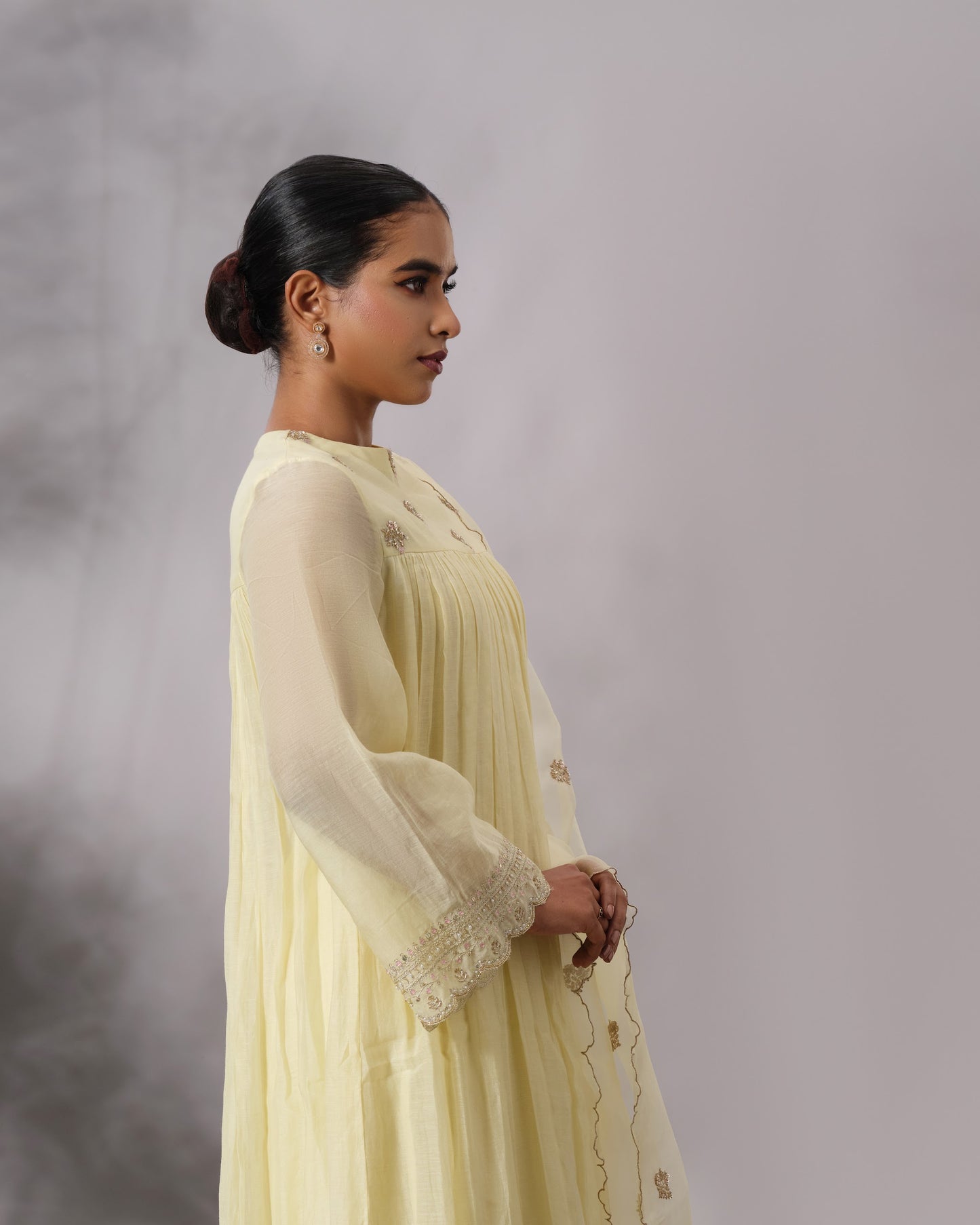 Model wearing the Butter Yellow Gathered Salwar Set by Kpret by Kalakaari