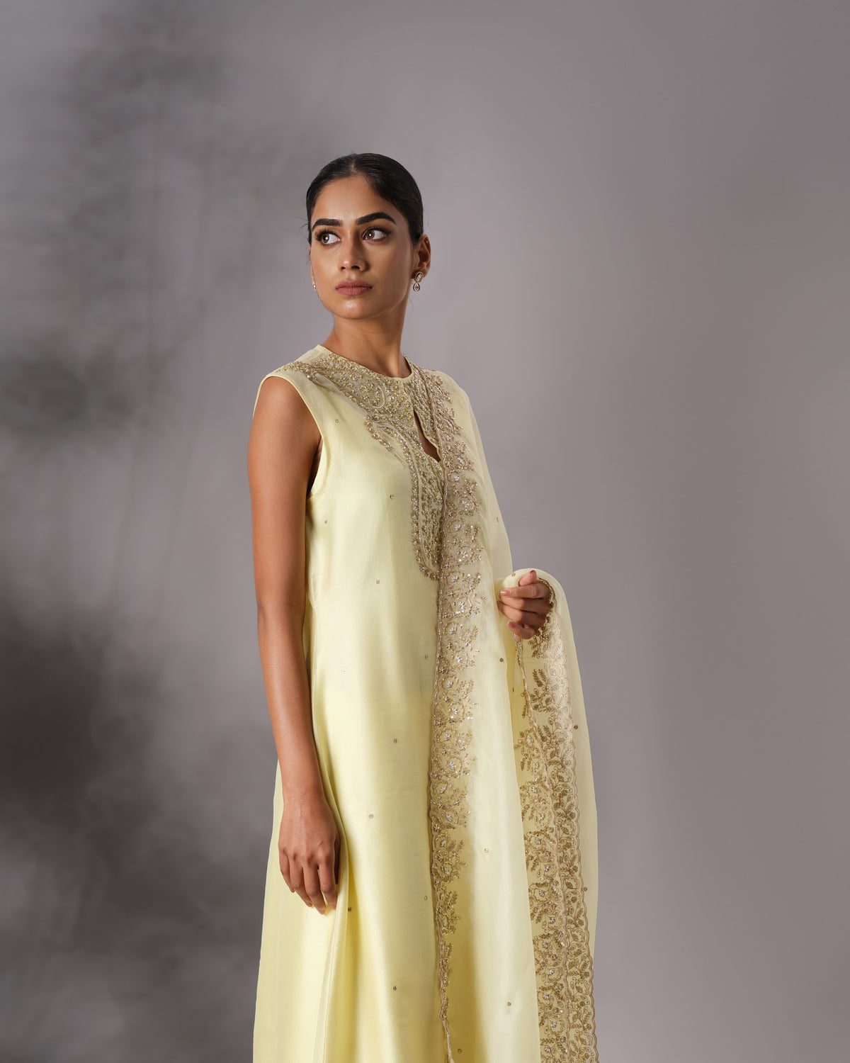Model wearing the Butter Yellow Hand-Embroidered Salwar Set by Kpret by Kalakaari