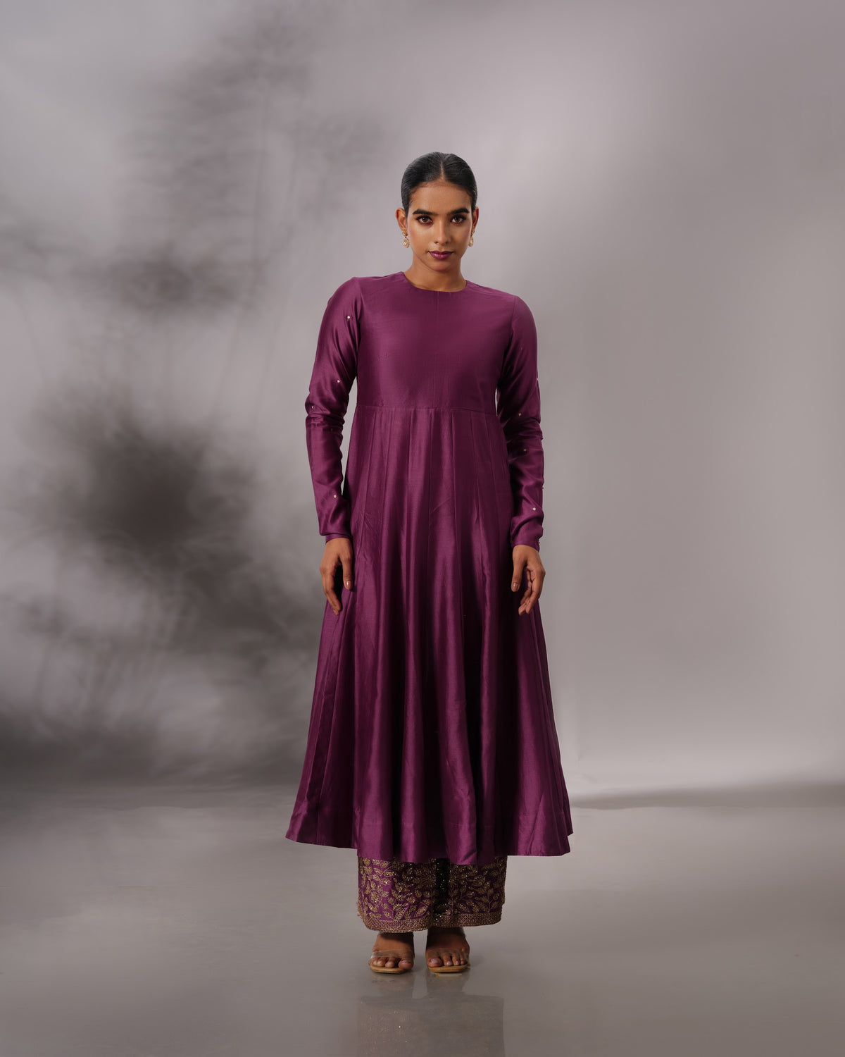Model wearing the Aubergine Panelled Anarkali Set by Kpret by Kalakaari