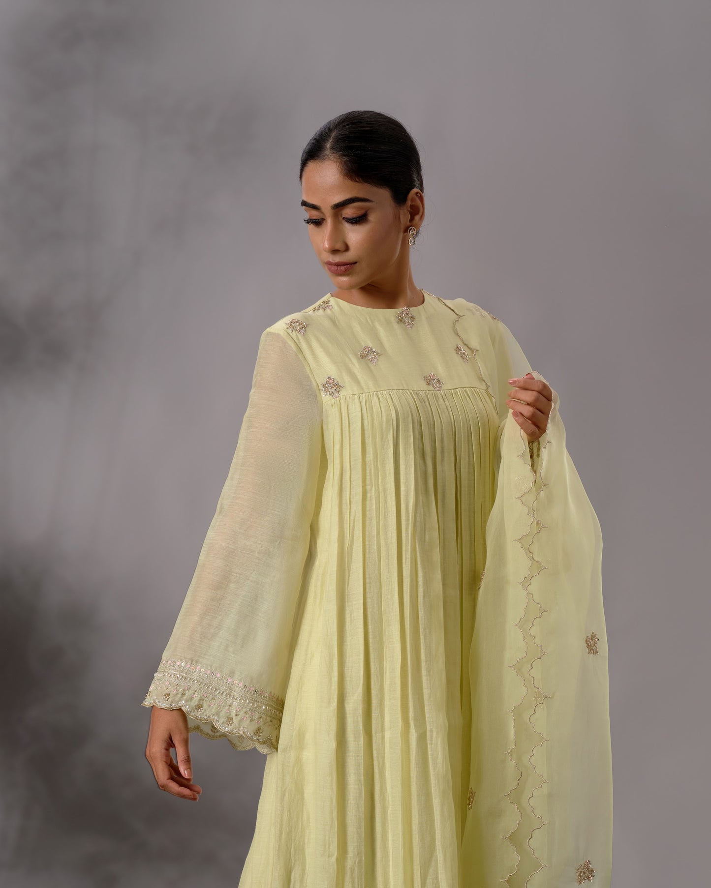 Model wearing the Pale Lime Yellow Gathered Salwar Set by Kpret by Kalakaari