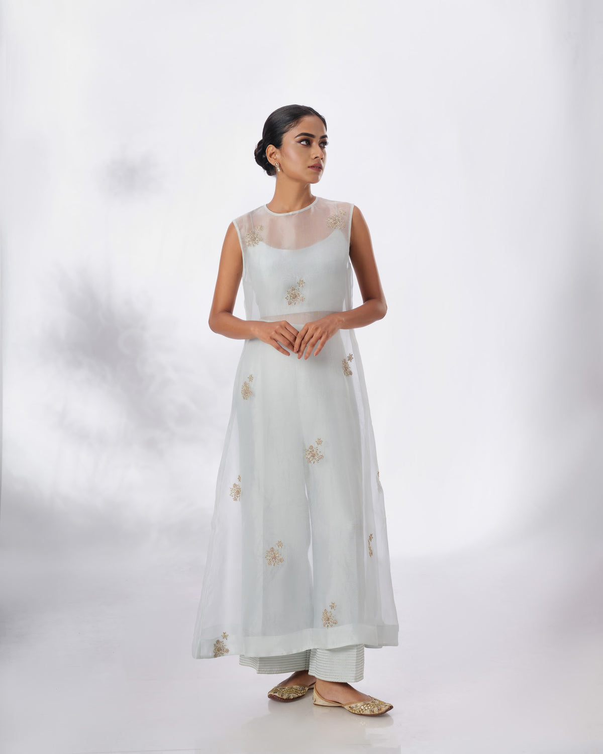 Model wearing the Spa Blue Silk Organza Butta Set by Kpret by Kalakaari