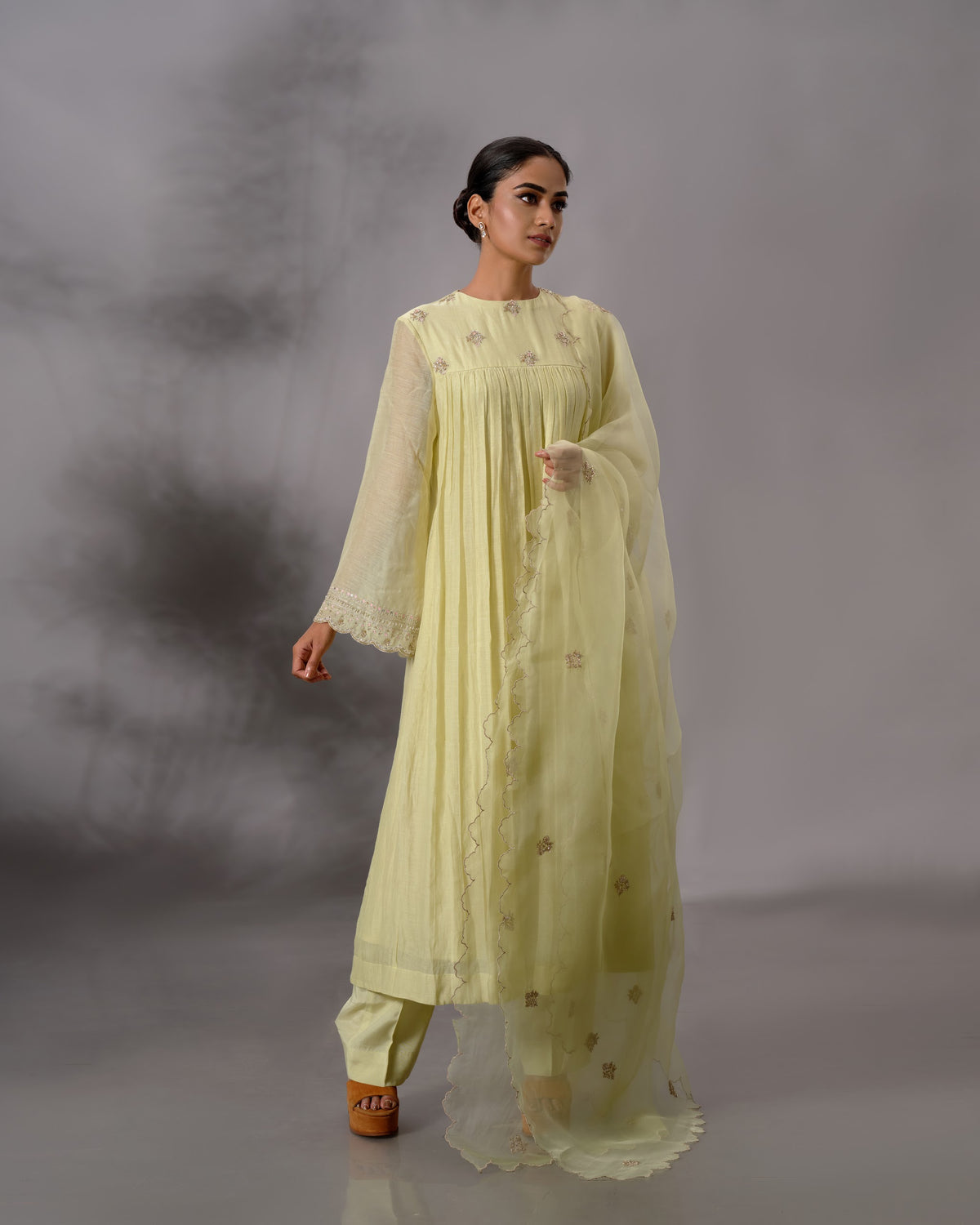 Model wearing the Pale Lime Yellow Gathered Salwar Set by Kpret by Kalakaari