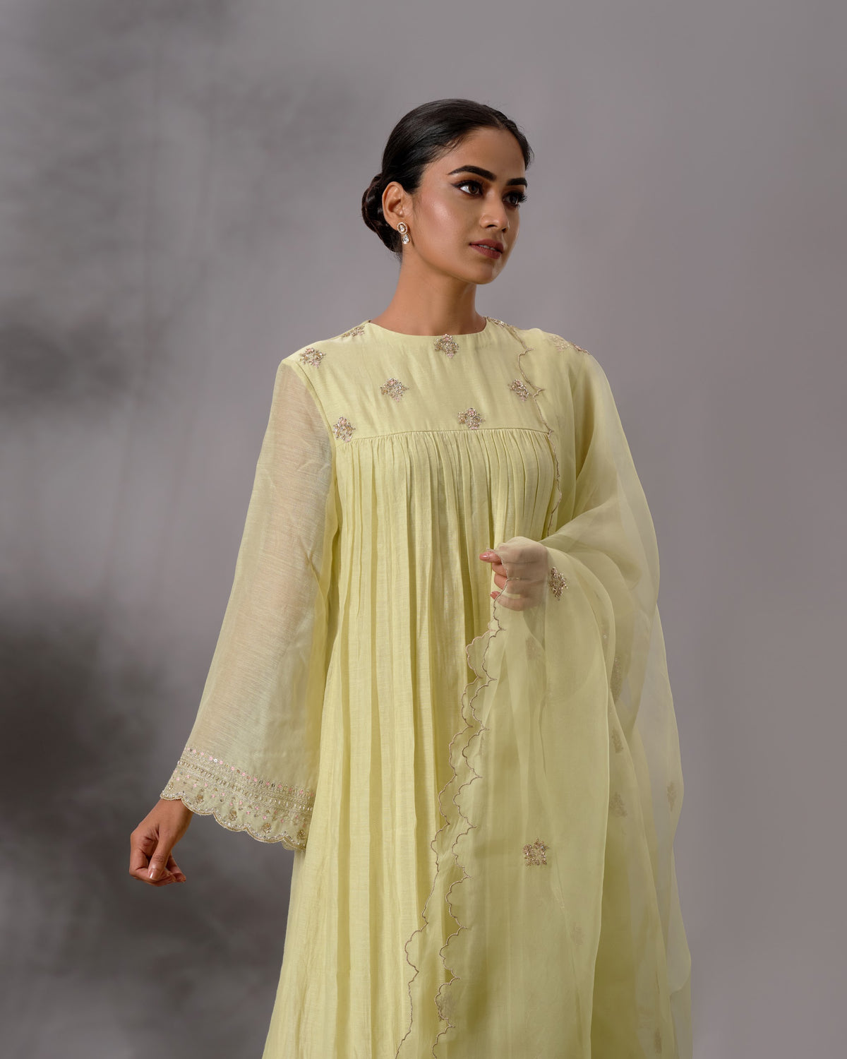 Model wearing the Pale Lime Yellow Gathered Salwar Set by Kpret by Kalakaari