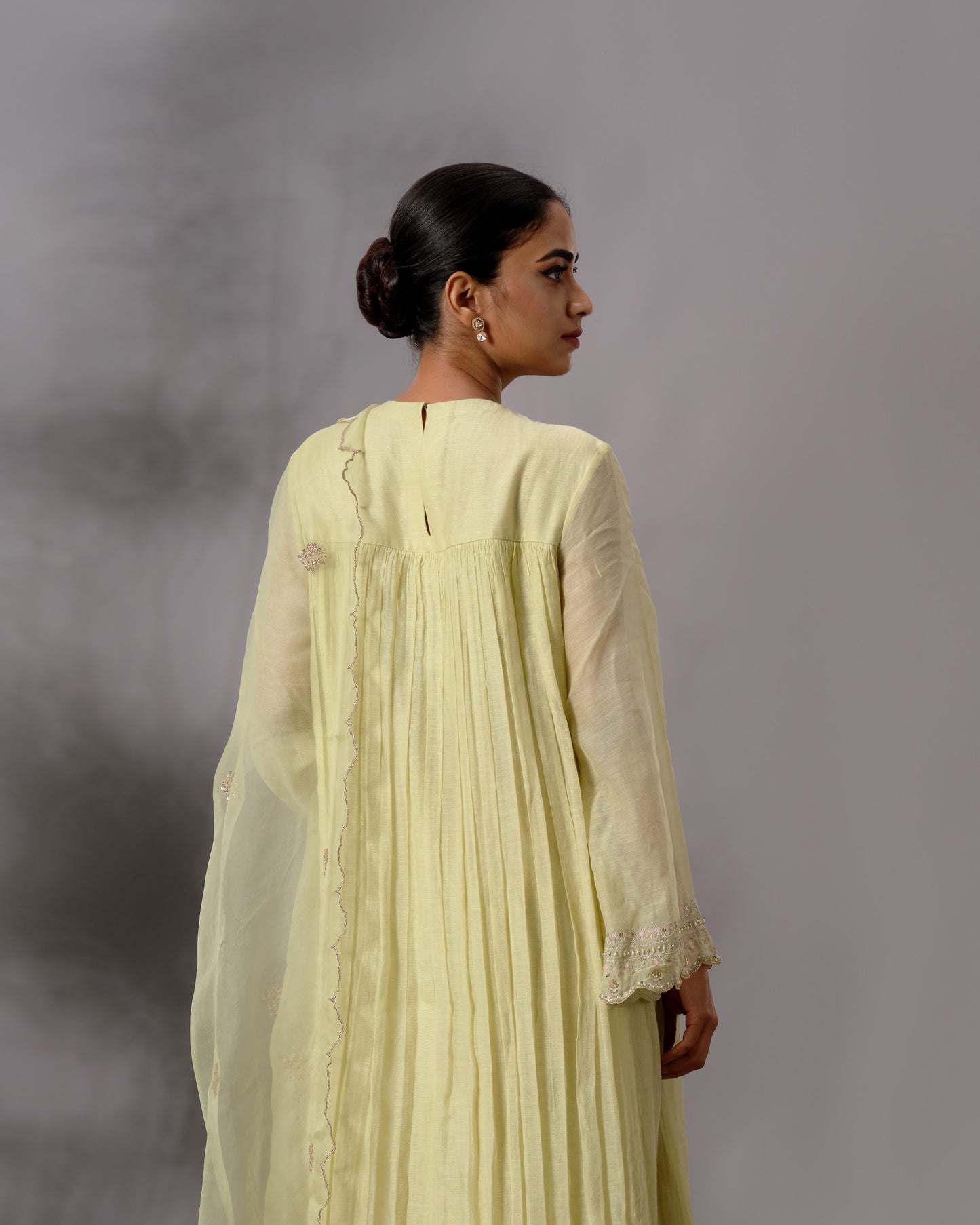 Model wearing the Pale Lime Yellow Gathered Salwar Set by Kpret by Kalakaari
