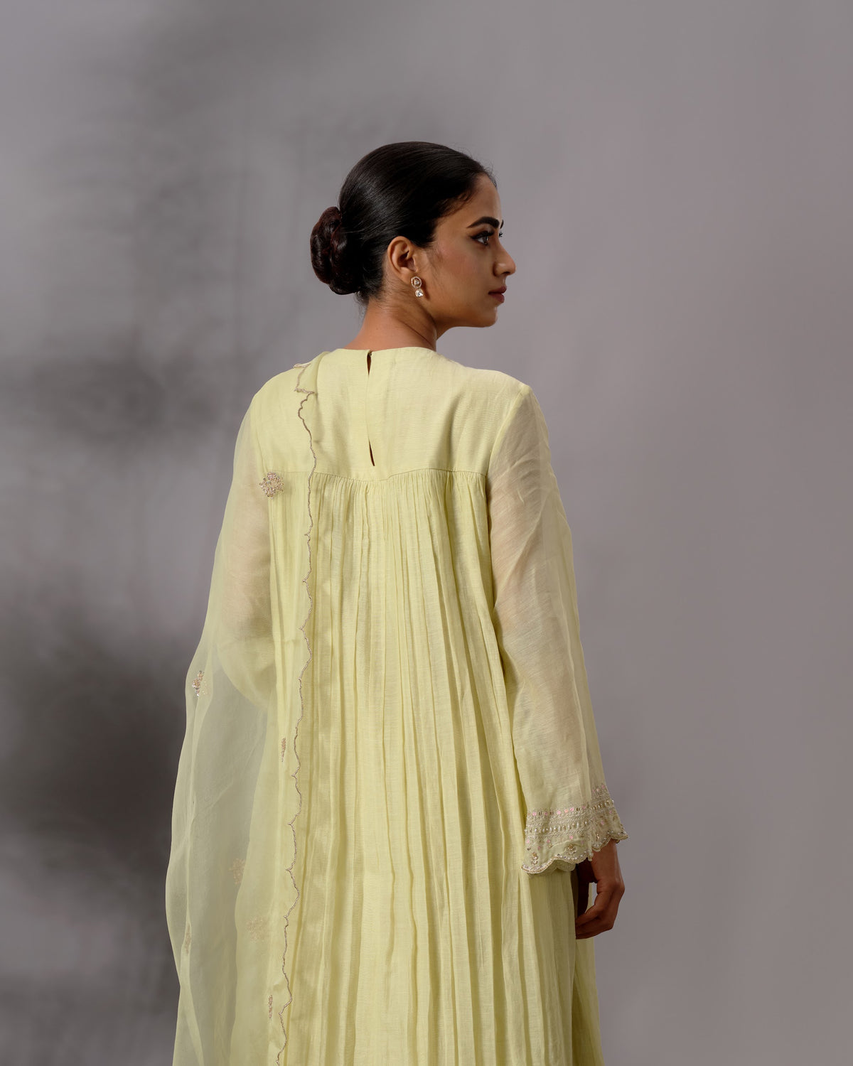Model wearing the Pale Lime Yellow Gathered Salwar Set by Kpret by Kalakaari