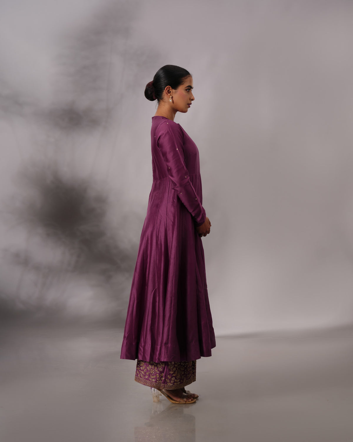 Model wearing the Aubergine Panelled Anarkali Set by Kpret by Kalakaari