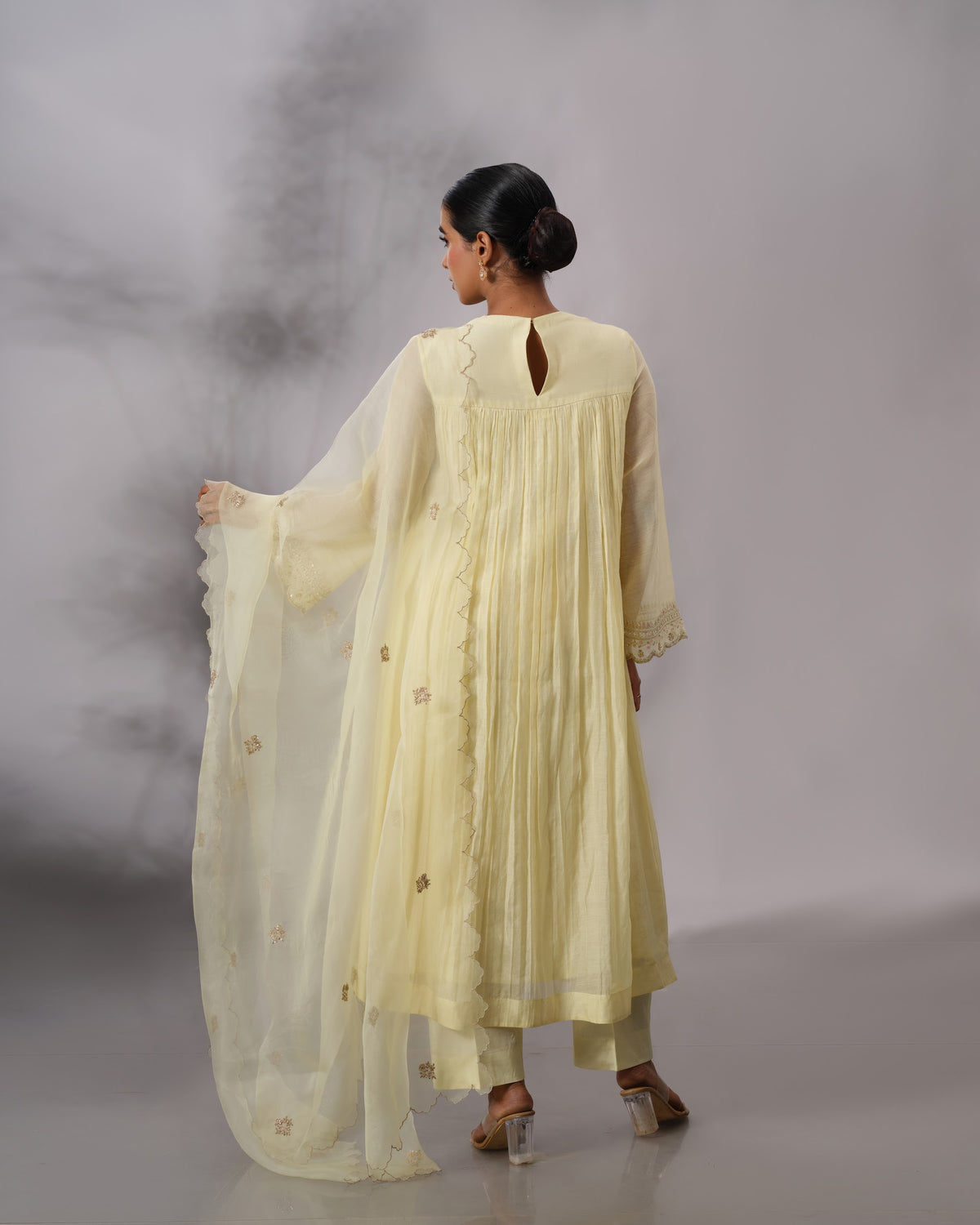 Model wearing the Butter Yellow Gathered Salwar Set by Kpret by Kalakaari
