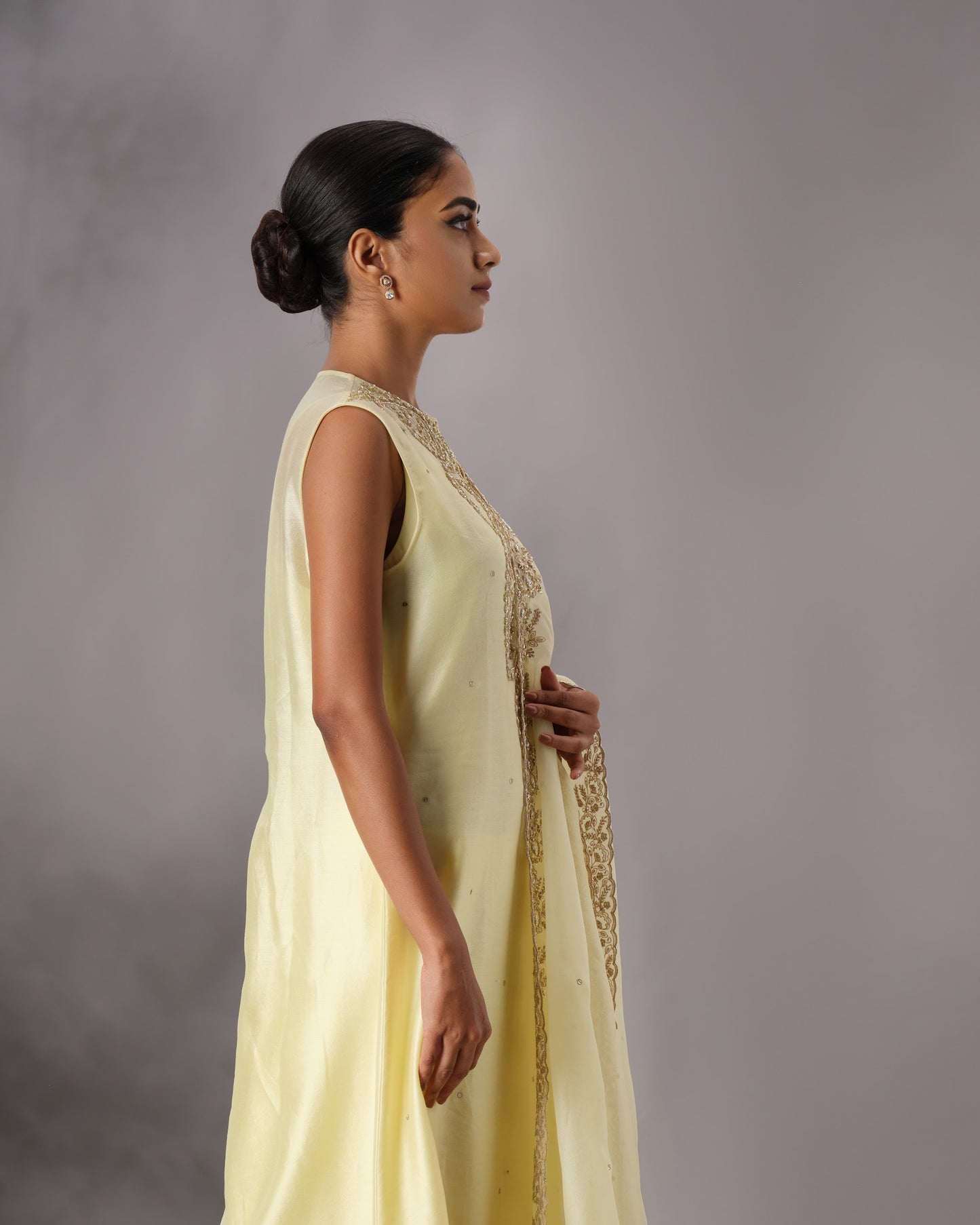 Model wearing the Butter Yellow Hand-Embroidered Salwar Set by Kpret by Kalakaari