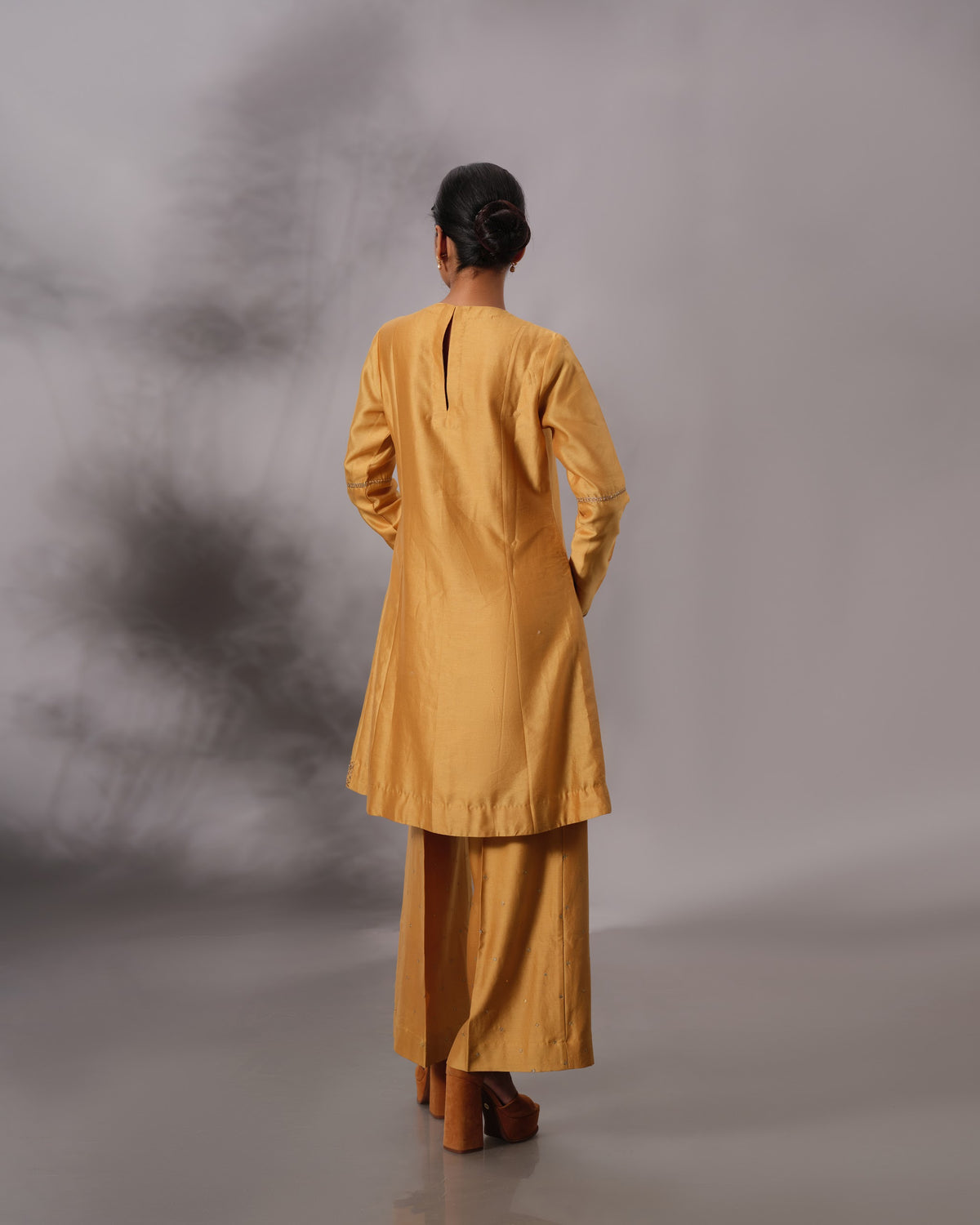 Model wearing the Mustard Yellow Panelled Midi Set by Kpret by Kalakaari