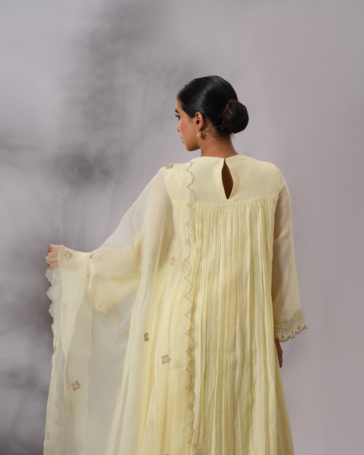 Model wearing the Butter Yellow Gathered Salwar Set by Kpret by Kalakaari