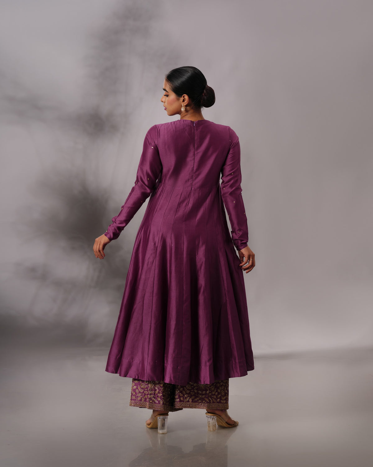Model wearing the Aubergine Panelled Anarkali Set by Kpret by Kalakaari