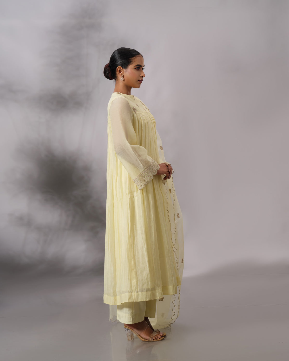 Model wearing the Butter Yellow Gathered Salwar Set by Kpret by Kalakaari