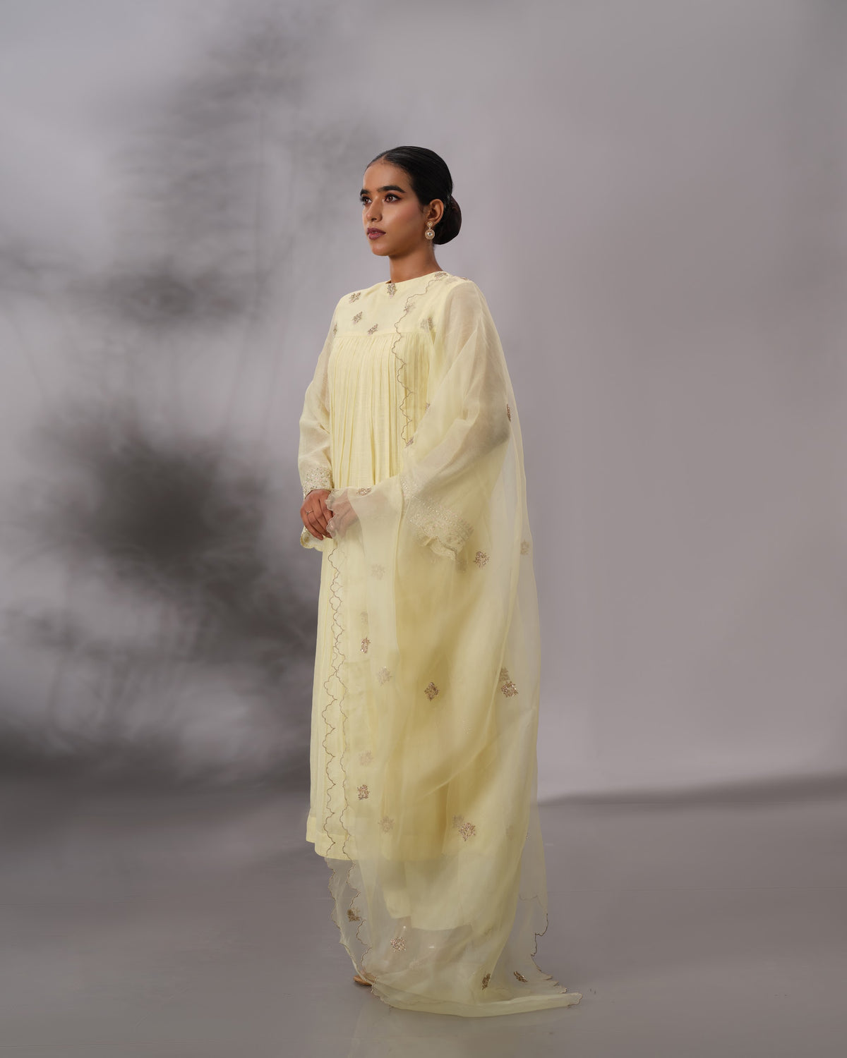 Model wearing the Butter Yellow Gathered Salwar Set by Kpret by Kalakaari