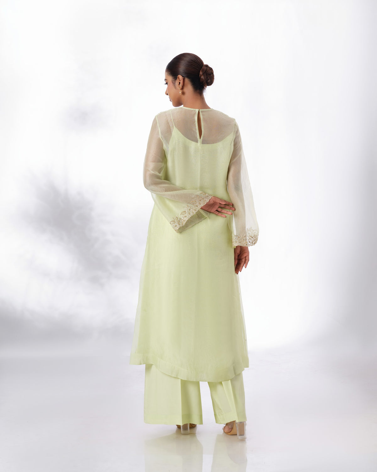 Model wearing the Lime Cream Silk Organza Set by Kpret by Kalakaari