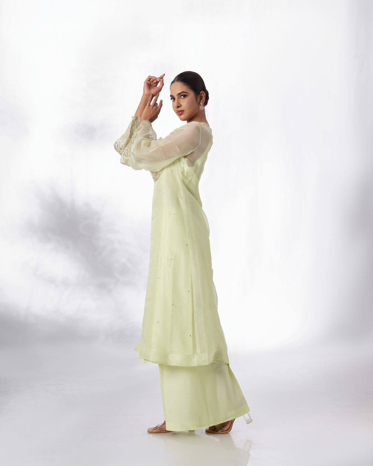 Model wearing the Lime Cream Silk Organza Set by Kpret by Kalakaari