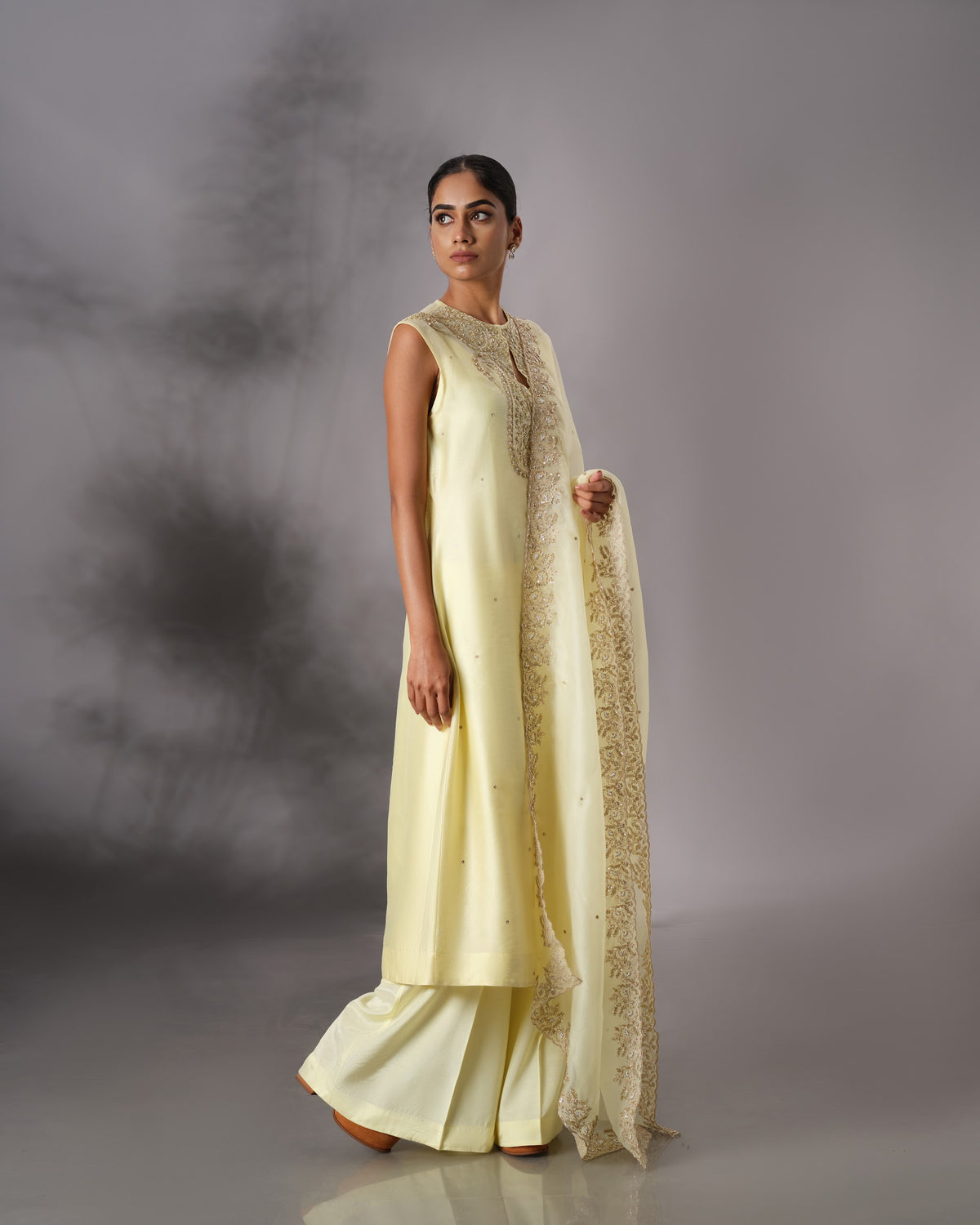 Model wearing the Butter Yellow Hand-Embroidered Salwar Set by Kpret by Kalakaari