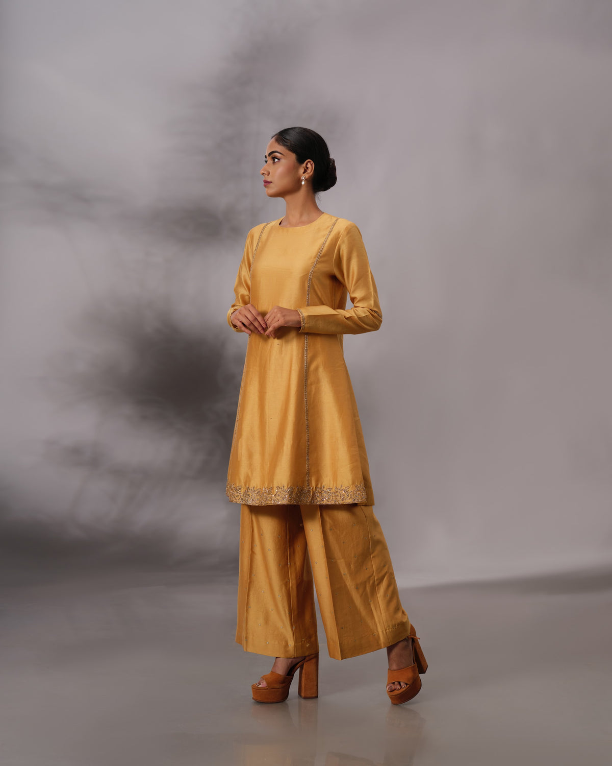 Model wearing the Mustard Yellow Panelled Midi Set by Kpret by Kalakaari