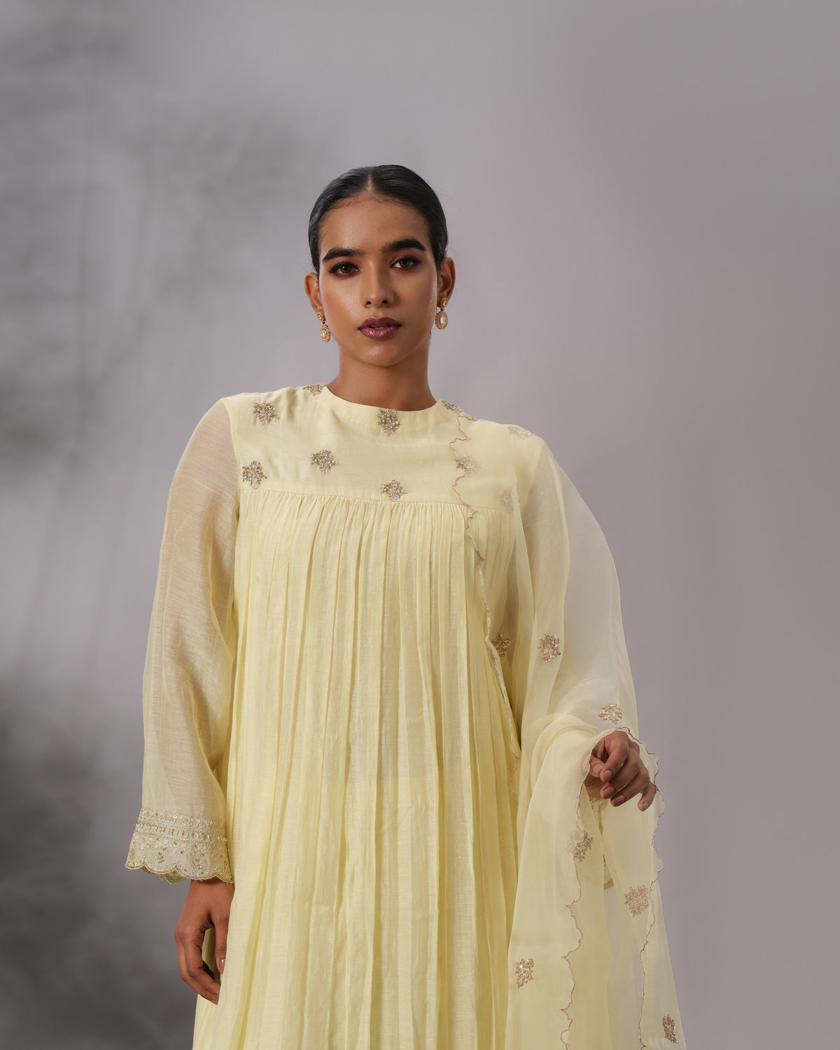 Model wearing the Butter Yellow Gathered Salwar Set by Kpret by Kalakaari