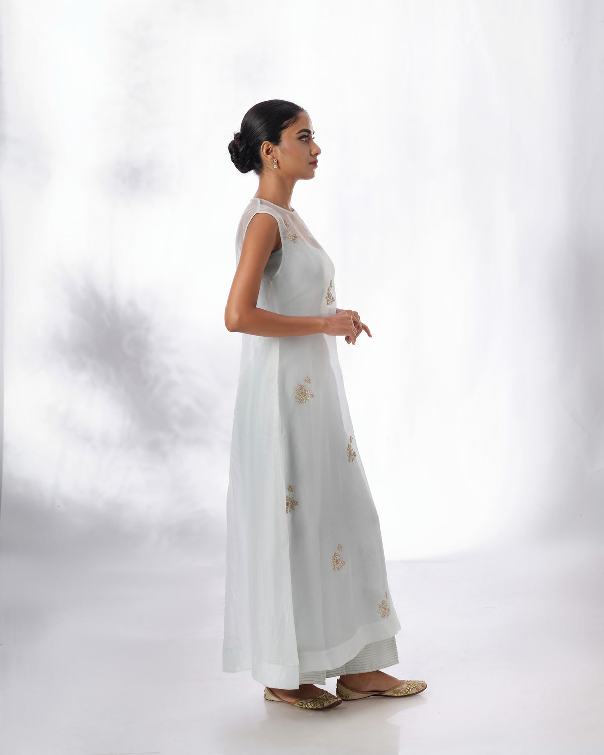 Model wearing the Spa Blue Silk Organza Butta Set by Kpret by Kalakaari