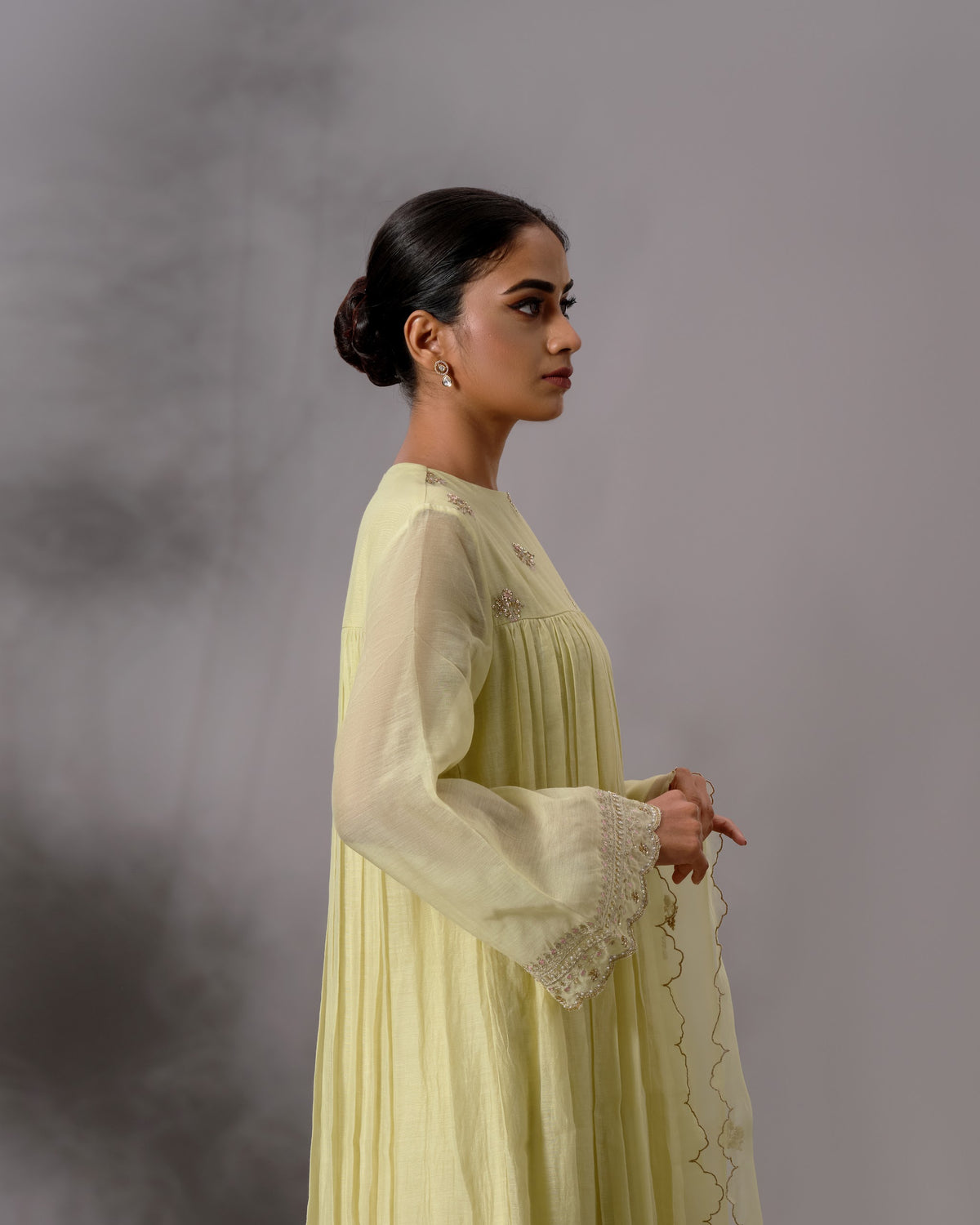 Model wearing the Pale Lime Yellow Gathered Salwar Set by Kpret by Kalakaari