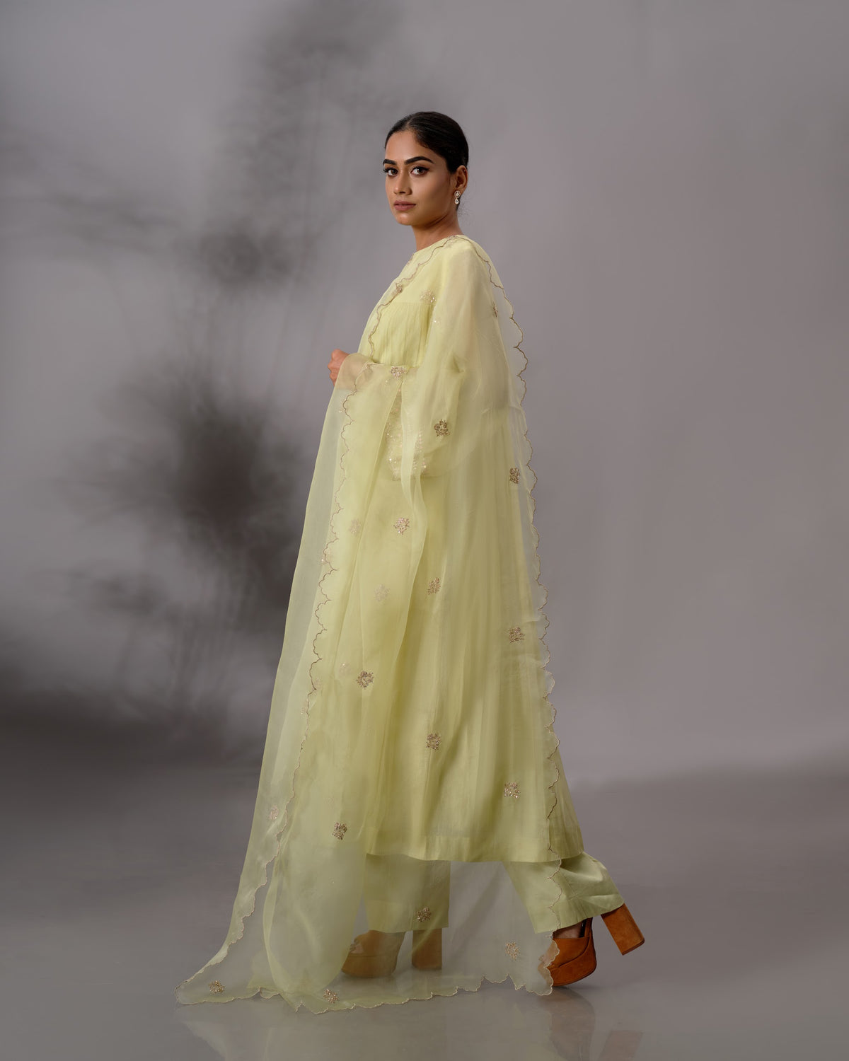 Model wearing the Pale Lime Yellow Gathered Salwar Set by Kpret by Kalakaari