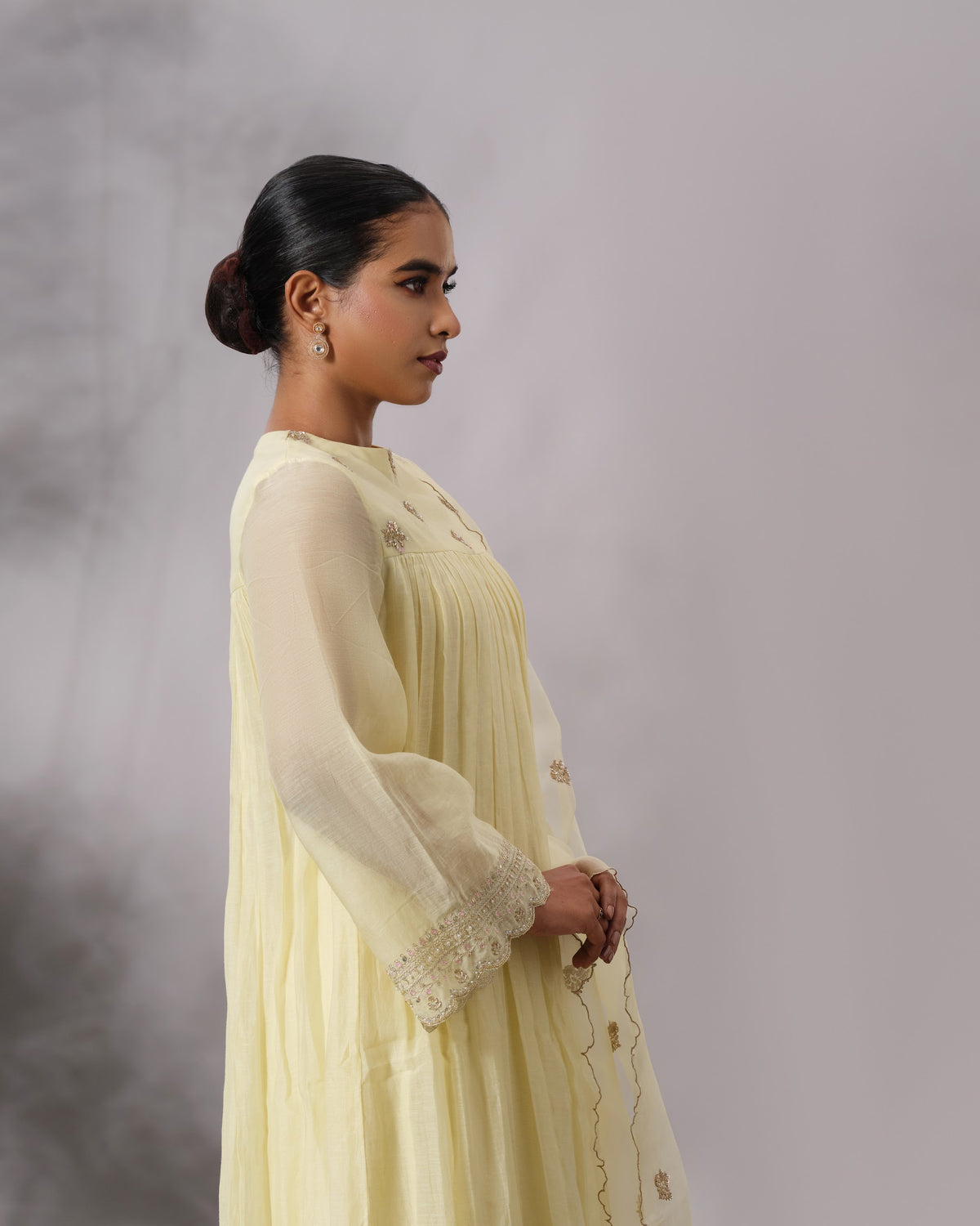 Model wearing the Butter Yellow Gathered Salwar Set by Kpret by Kalakaari