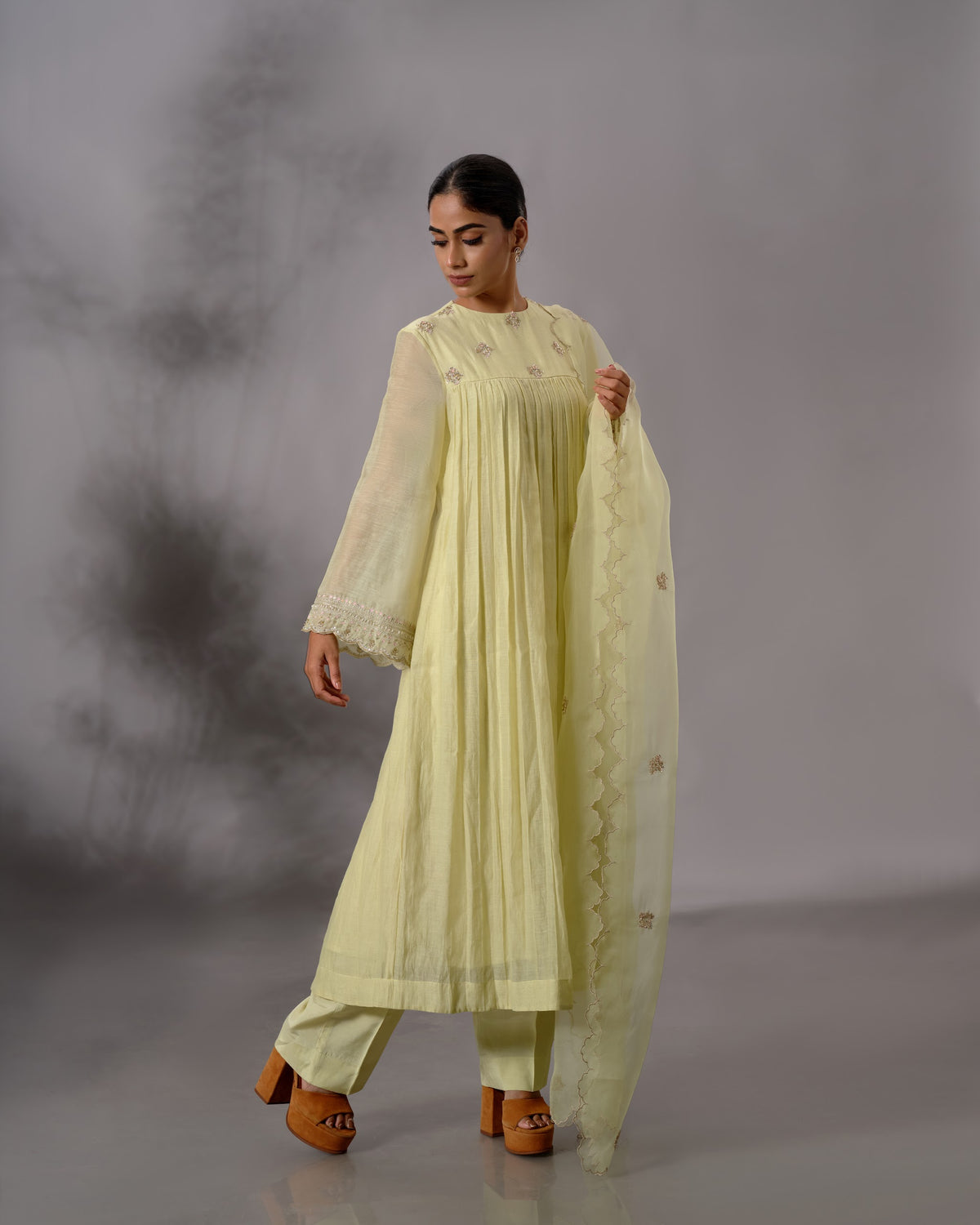Model wearing the Pale Lime Yellow Gathered Salwar Set by Kpret by Kalakaari