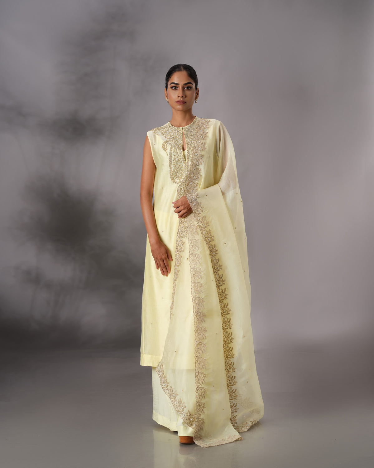Model wearing the Butter Yellow Hand-Embroidered Salwar Set by Kpret by Kalakaari