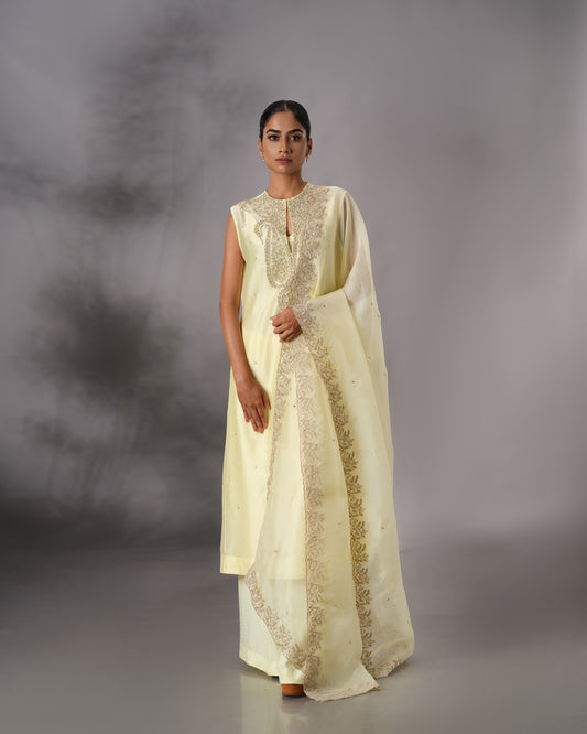 Model wearing the Butter Yellow Hand-Embroidered Salwar Set by Kpret by Kalakaari