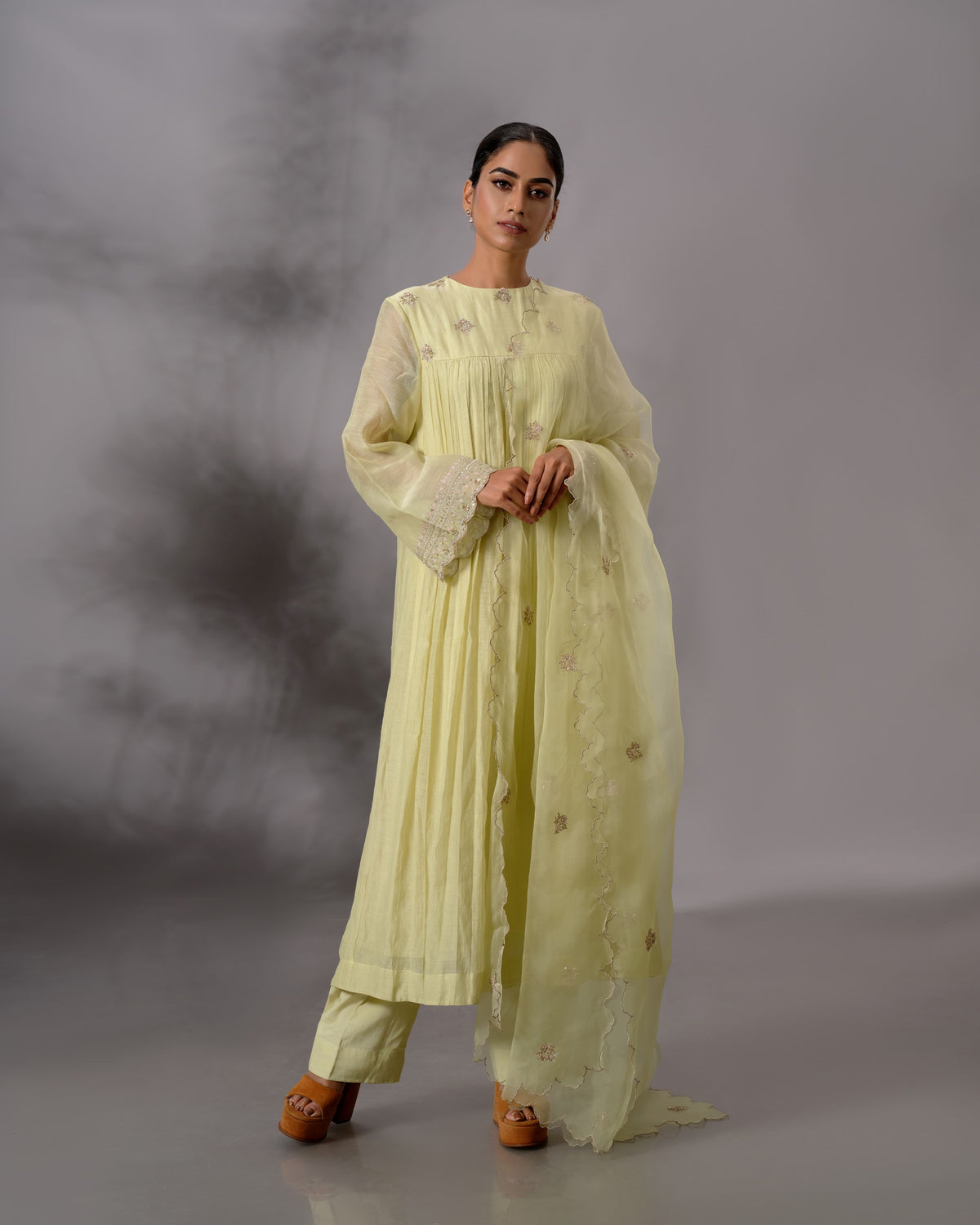Model wearing the Pale Lime Yellow Gathered Salwar Set by Kpret by Kalakaari