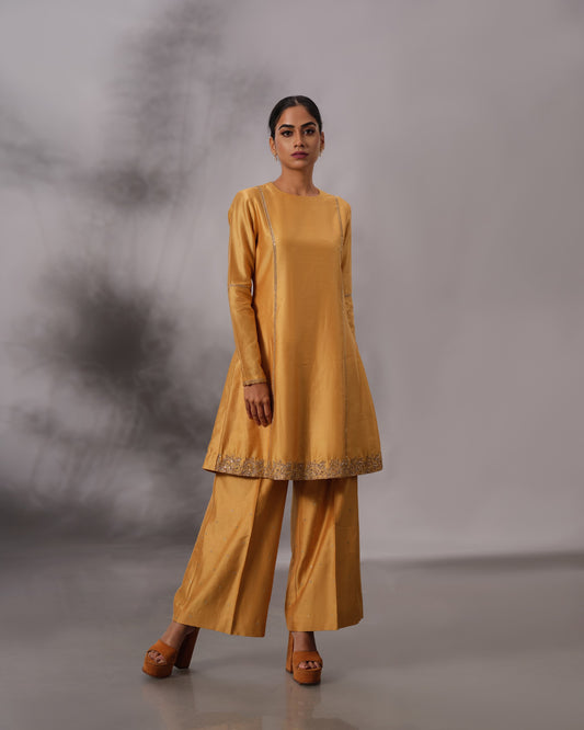 Model wearing the Mustard Yellow Panelled Midi Set by Kpret by Kalakaari