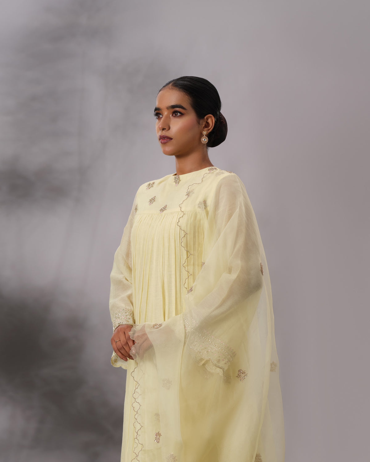 Model wearing the Butter Yellow Gathered Salwar Set by Kpret by Kalakaari