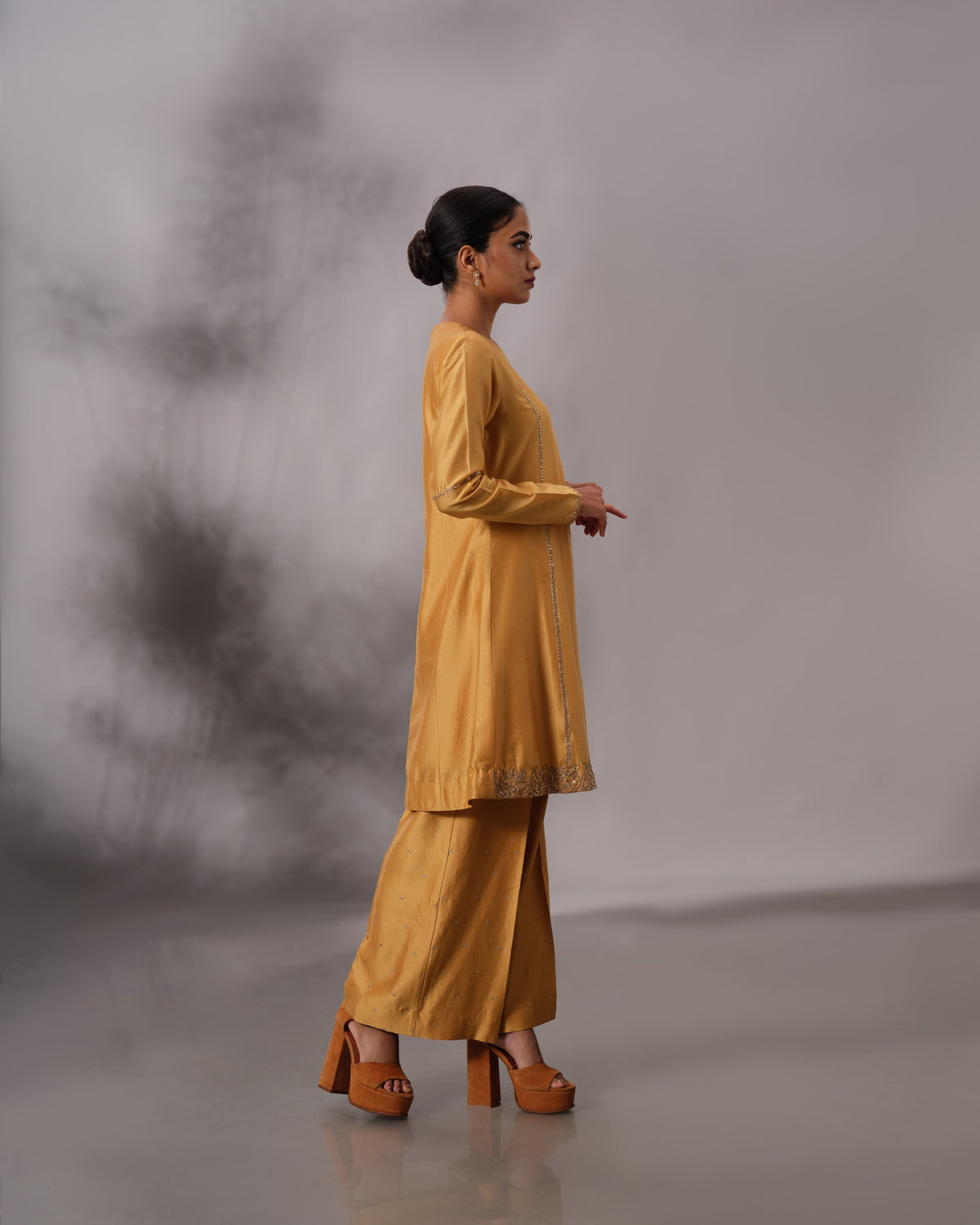 Model wearing the Mustard Yellow Panelled Midi Set by Kpret by Kalakaari