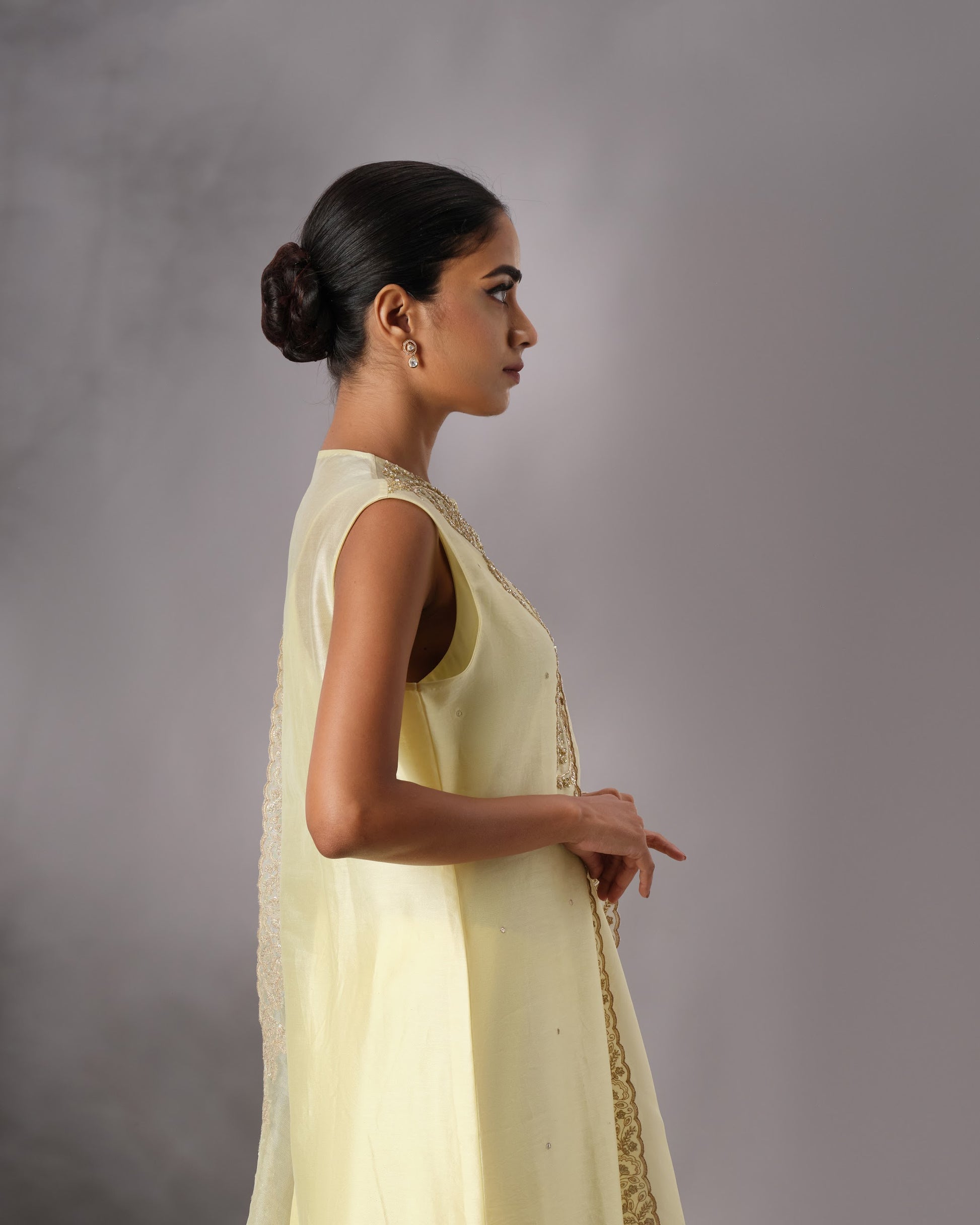 Model wearing the Butter Yellow Hand-Embroidered Salwar Set by Kpret by Kalakaari