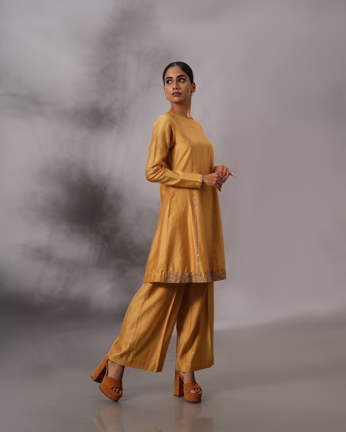 Model wearing the Mustard Yellow Panelled Midi Set by Kpret by Kalakaari