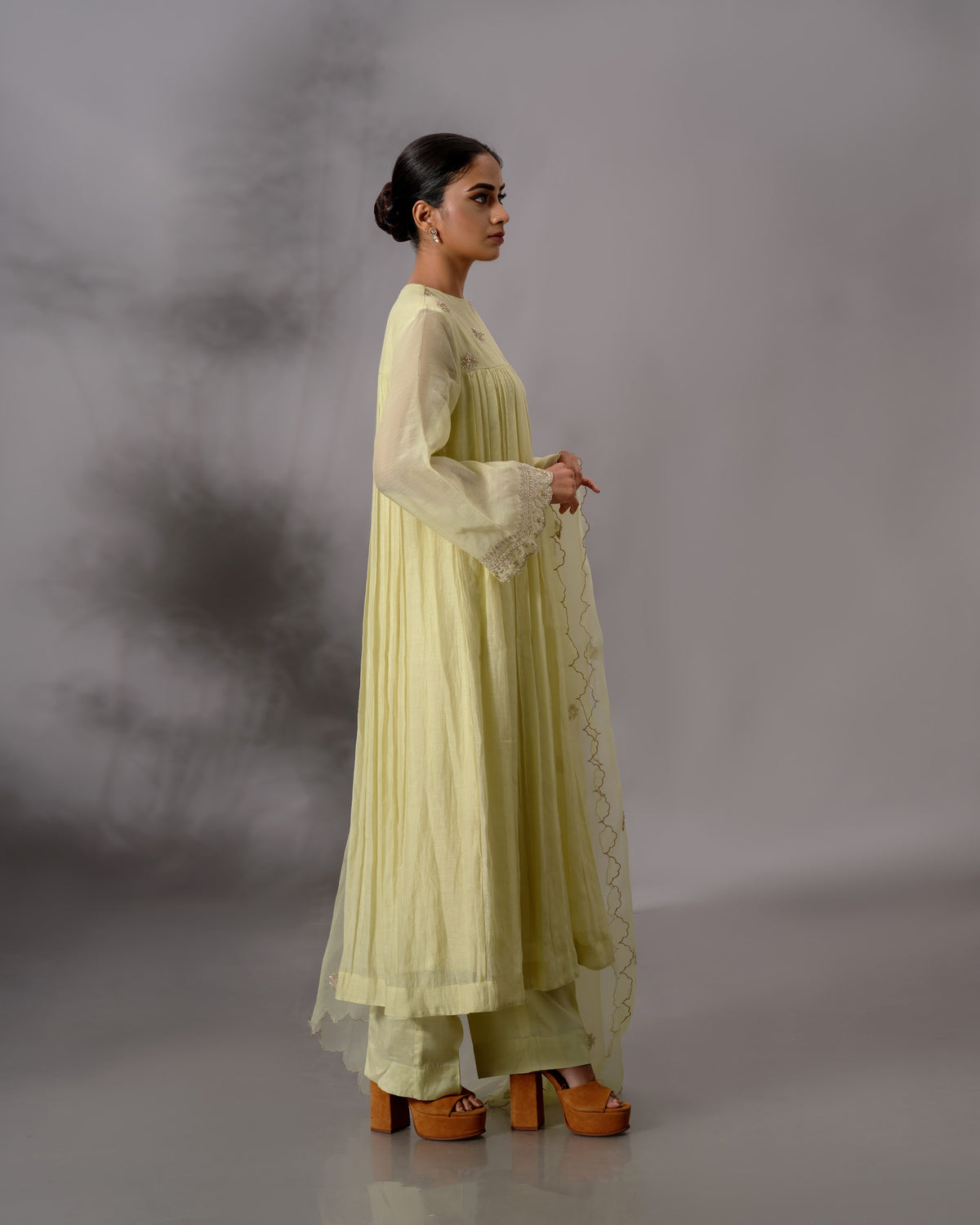 Model wearing the Pale Lime Yellow Gathered Salwar Set by Kpret by Kalakaari