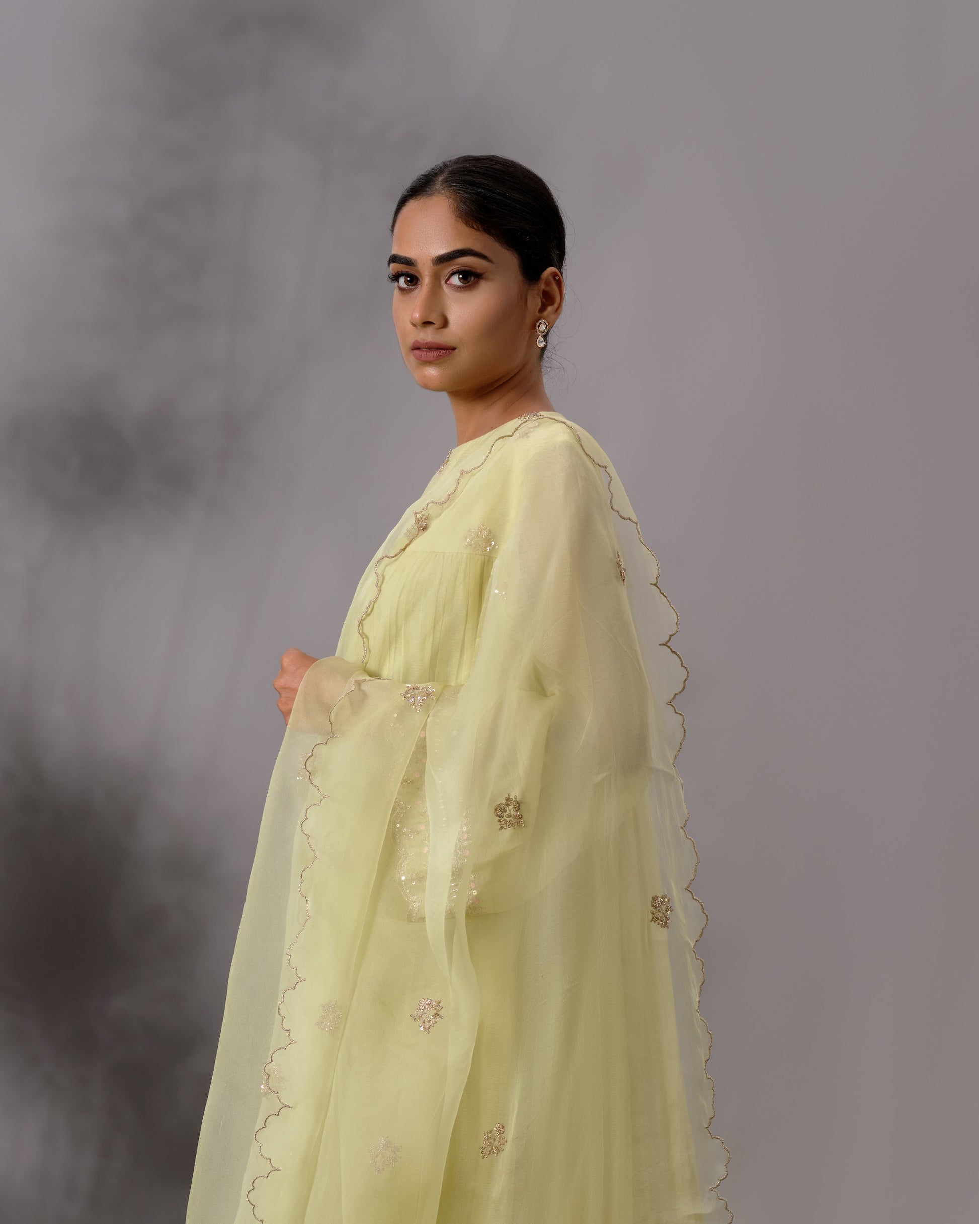 Model wearing the Pale Lime Yellow Gathered Salwar Set by Kpret by Kalakaari