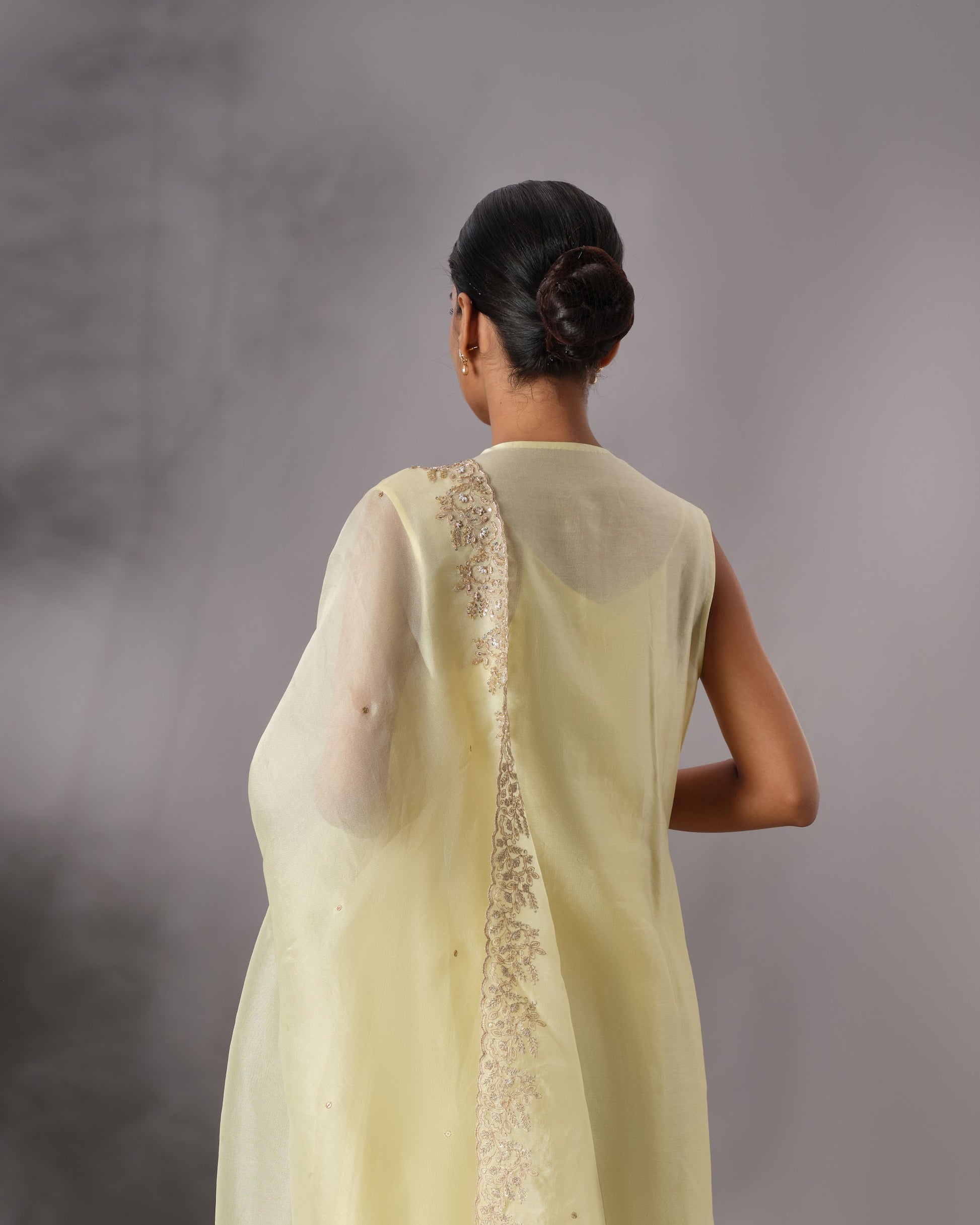Model wearing the Butter Yellow Hand-Embroidered Salwar Set by Kpret by Kalakaari